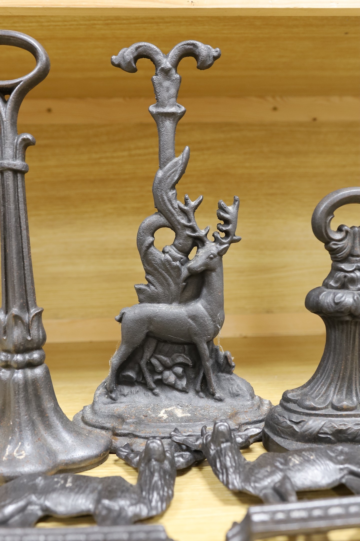 5 cast iron door stops, three of deer, tallest 39.5 cms high